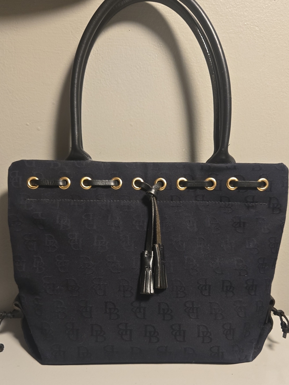 Dooney & Bourke Black Canvas Tote Bag with Tassel Detail